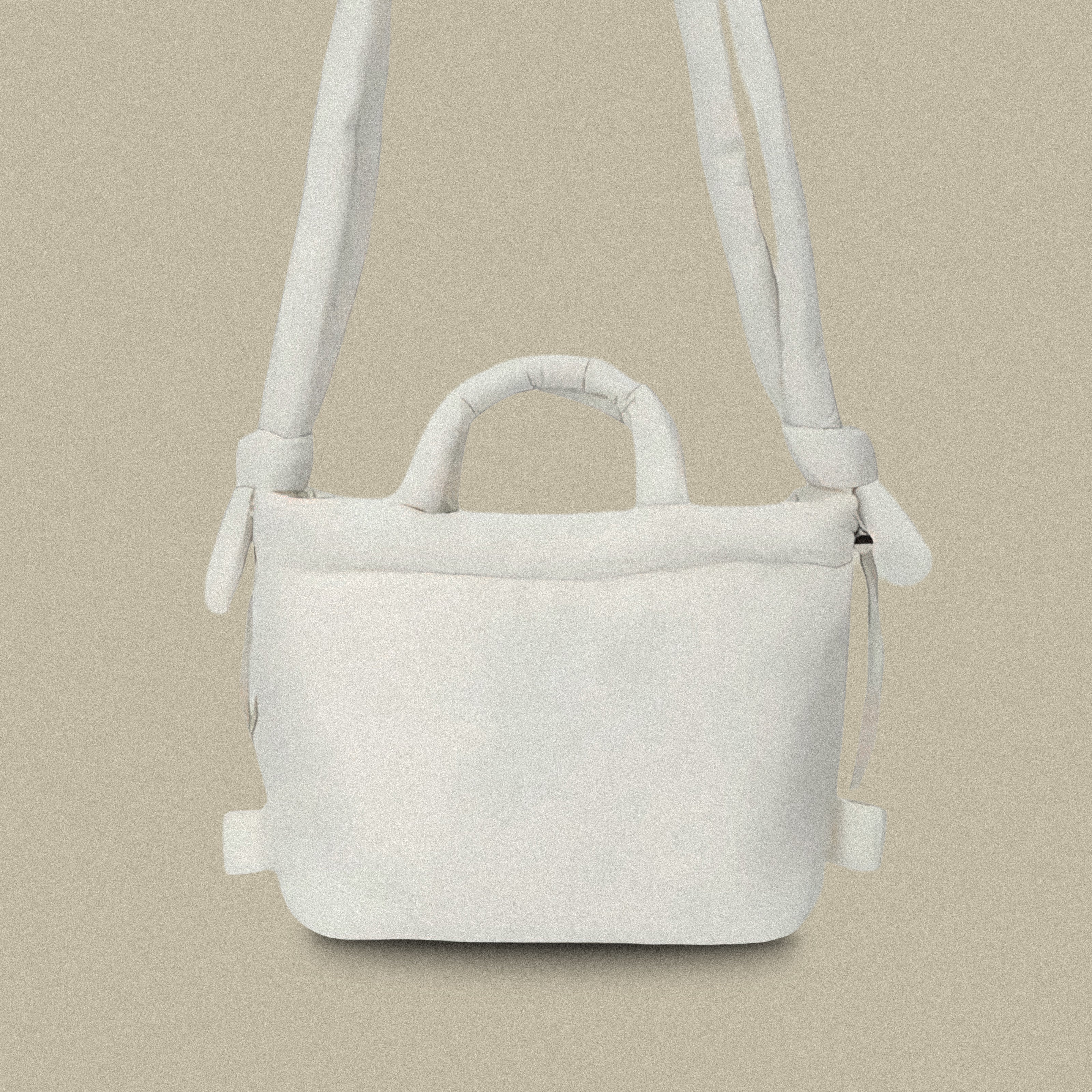 PLSH white women’s designer puffer handbag on a white background