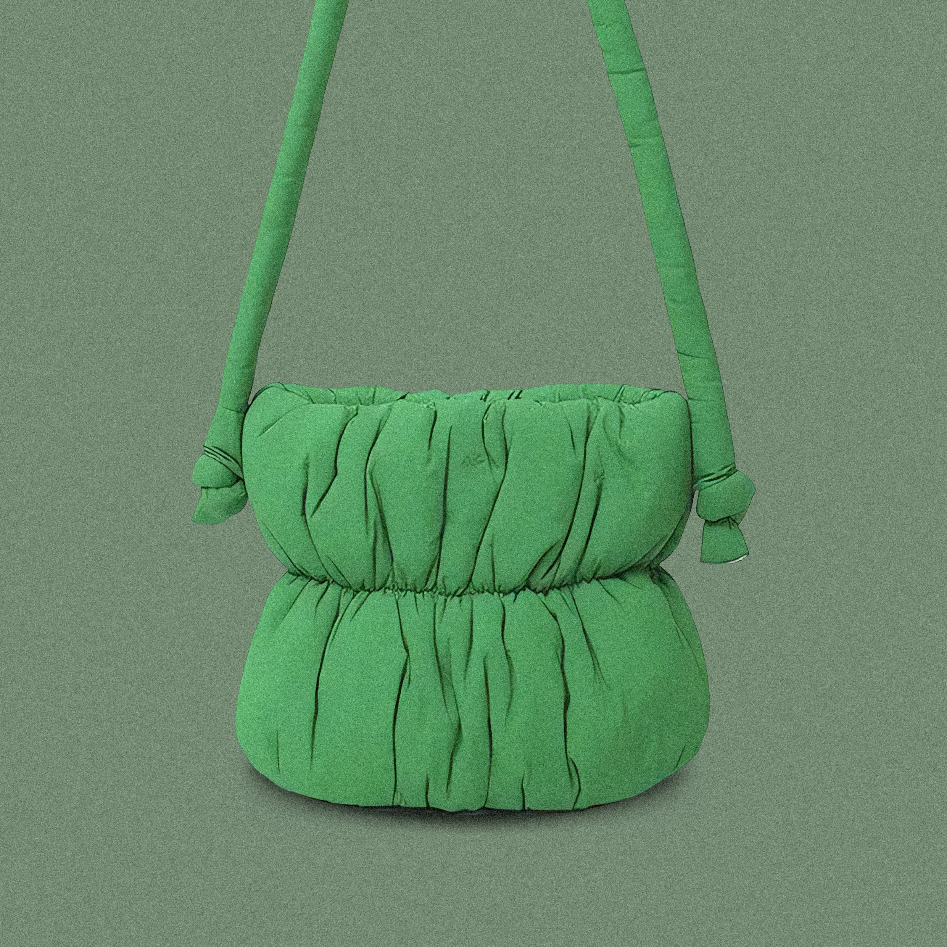 PLSH green women’s designer puffer handbag on a green background