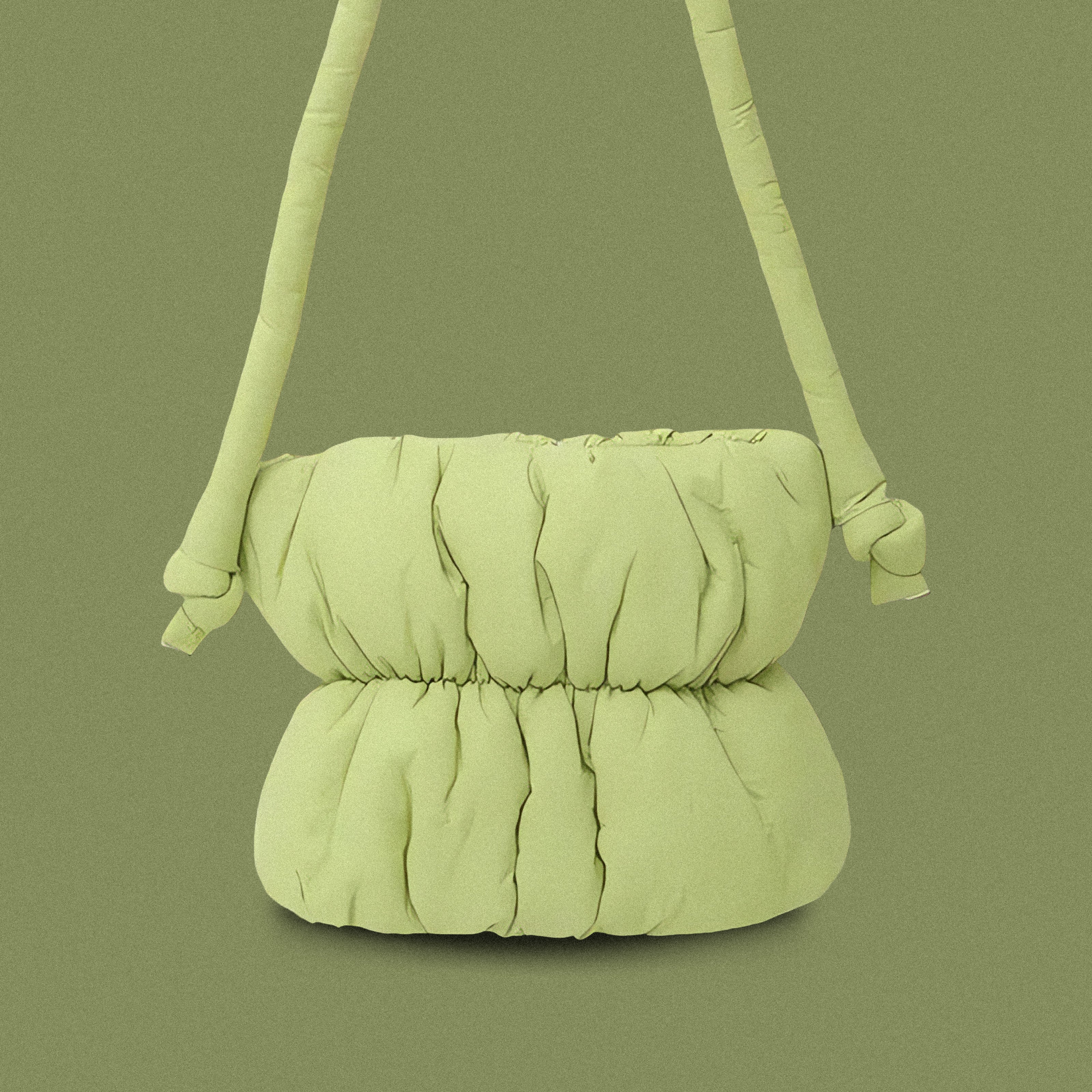 PLSH lime green women’s designer puffer handbag on a green background