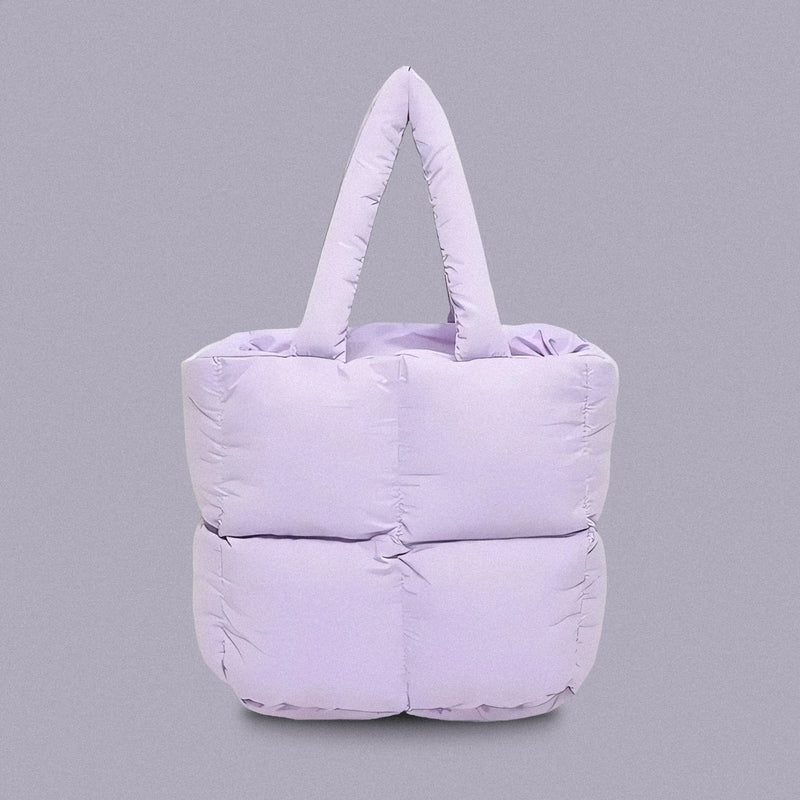 PLSH lilac women’s designer puffer handbag on a lilac background