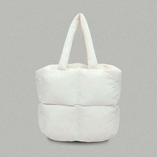 PLSH white women’s designer puffer handbag on a gray background