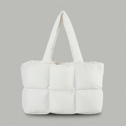 PLSH white women's designer puffer handbag on a gray background