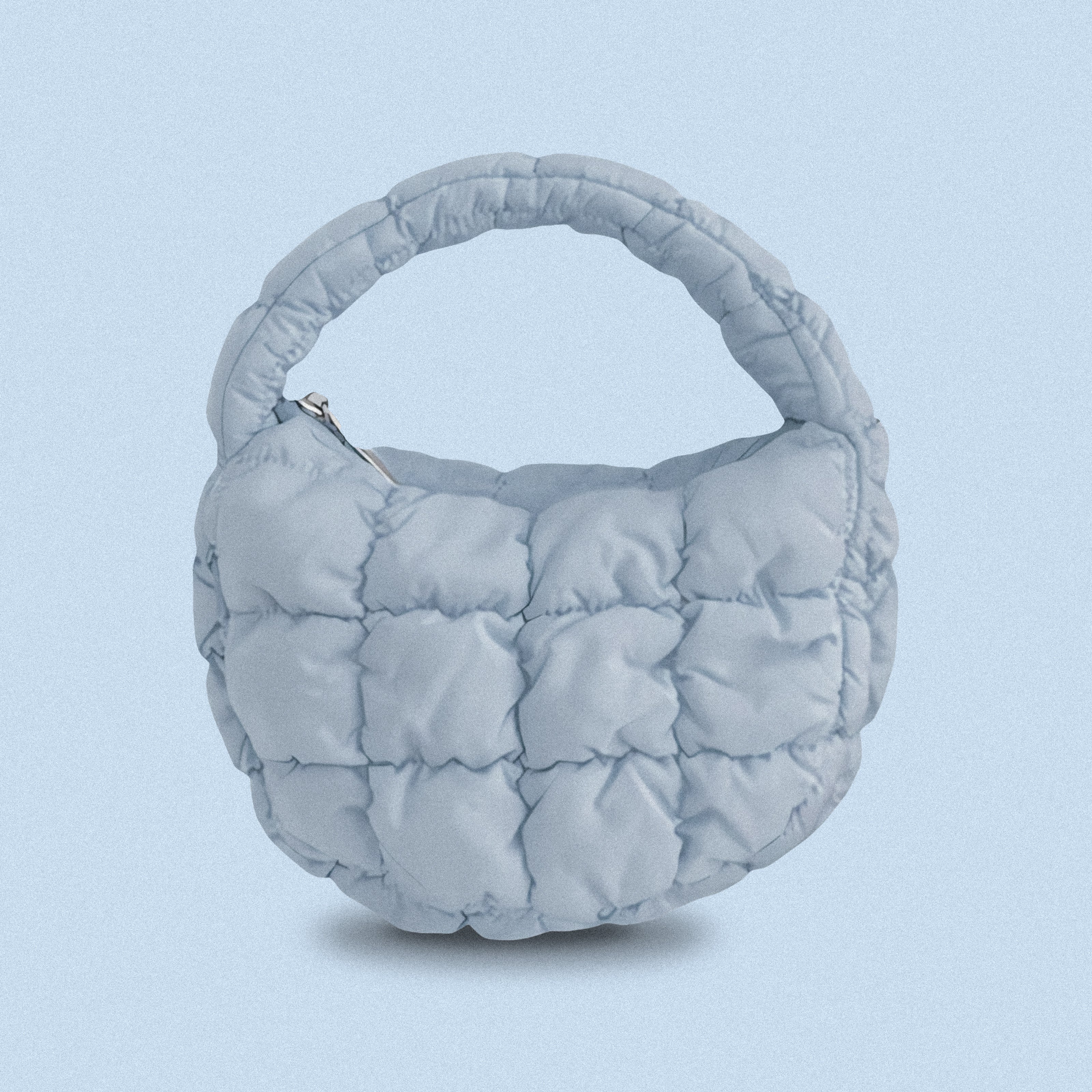 PLSH baby blue women’s designer puffer handbag on a blue background