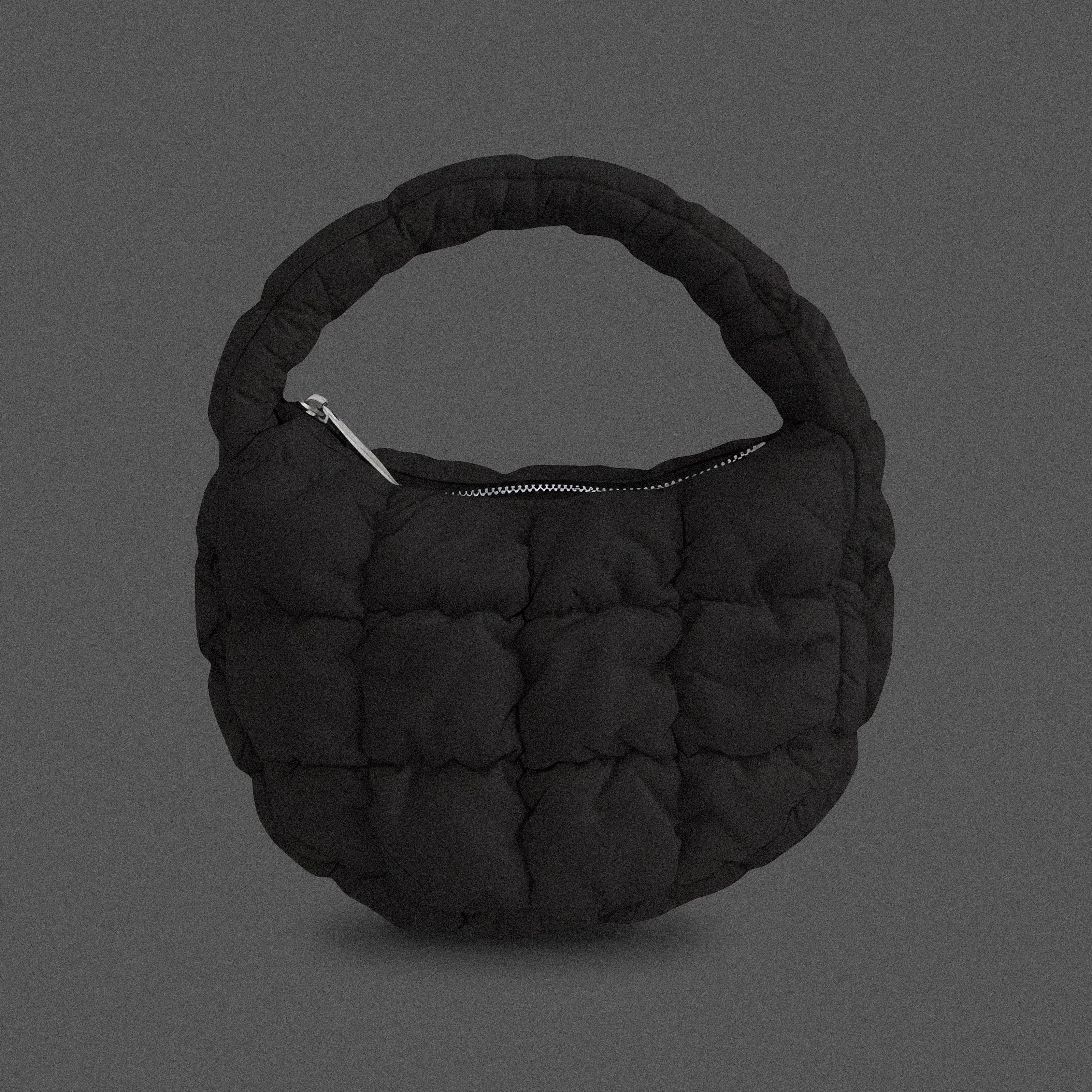 PLSH black women’s designer puffer handbag on a gray background