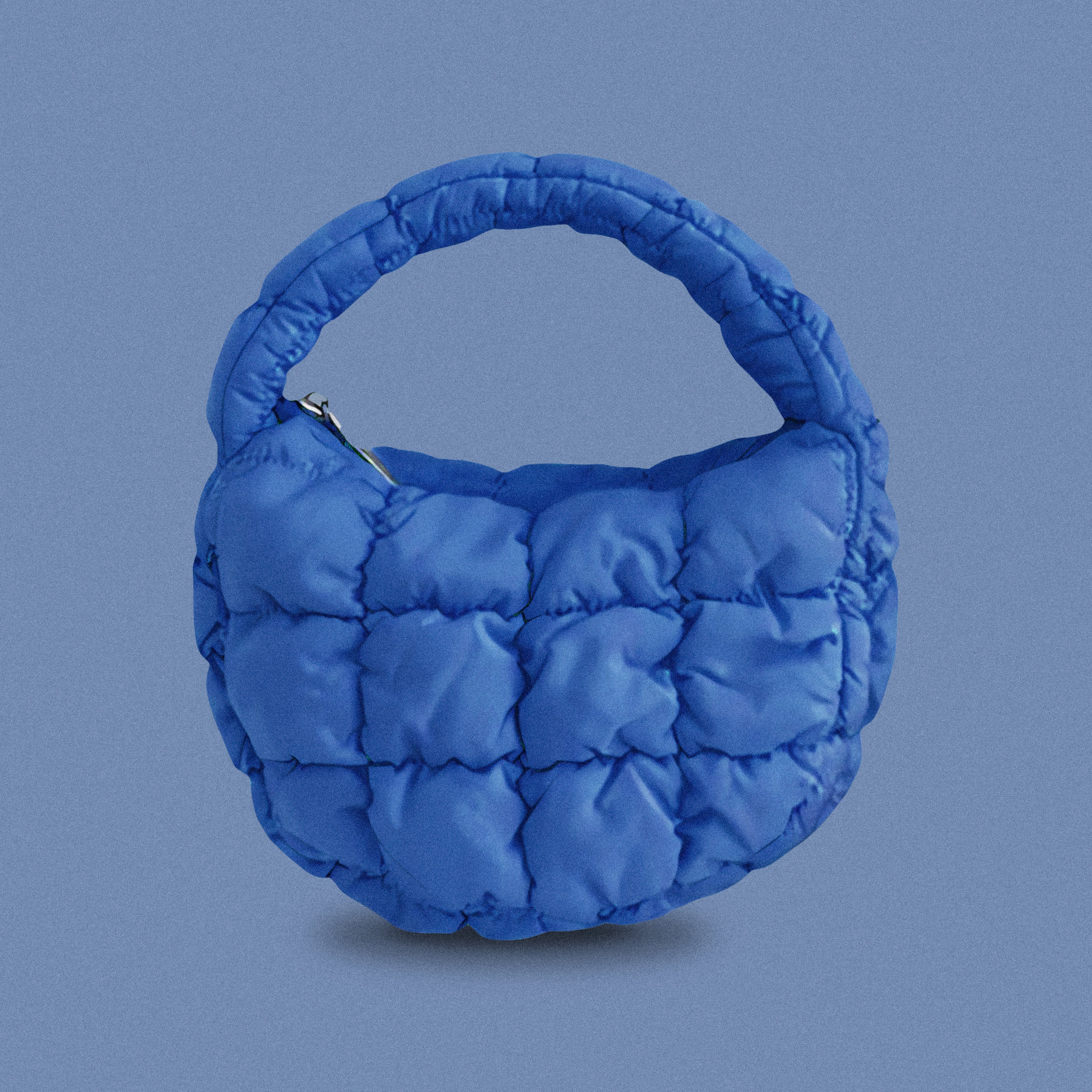 PLSH blue women’s designer puffer handbag on a blue background