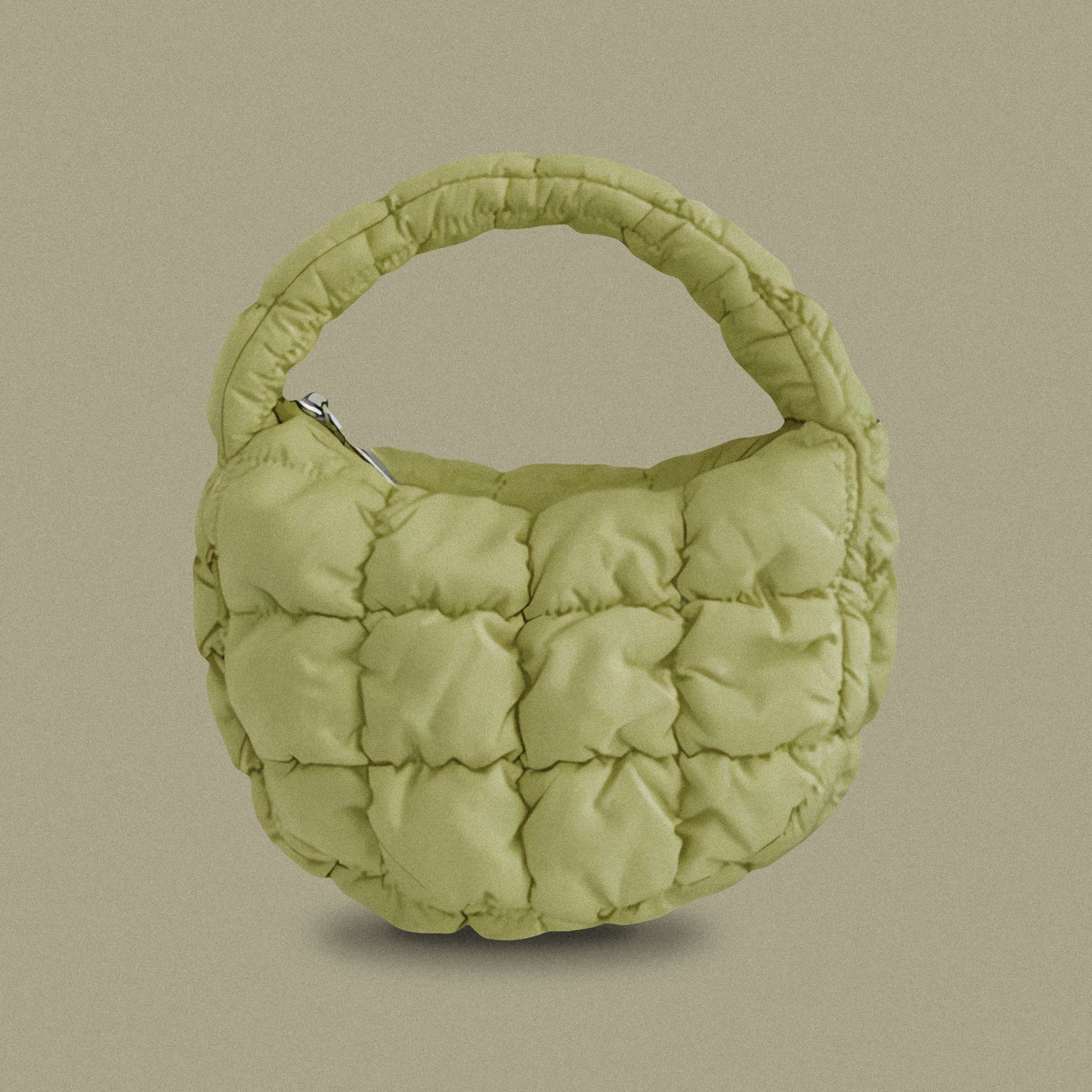 PLSH forest green women’s designer puffer handbag on a green background