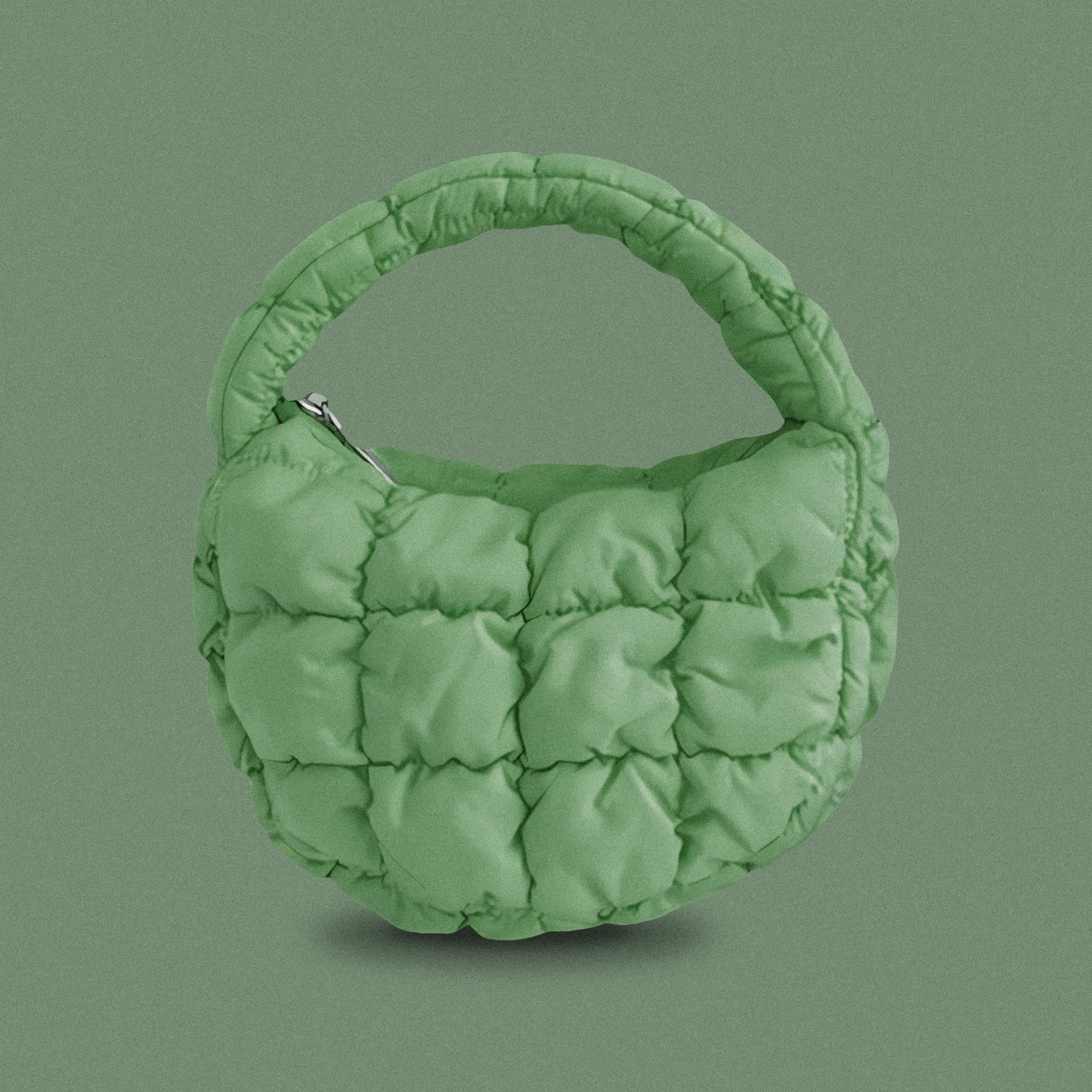 PLSH green women’s designer puffer handbag on a green background