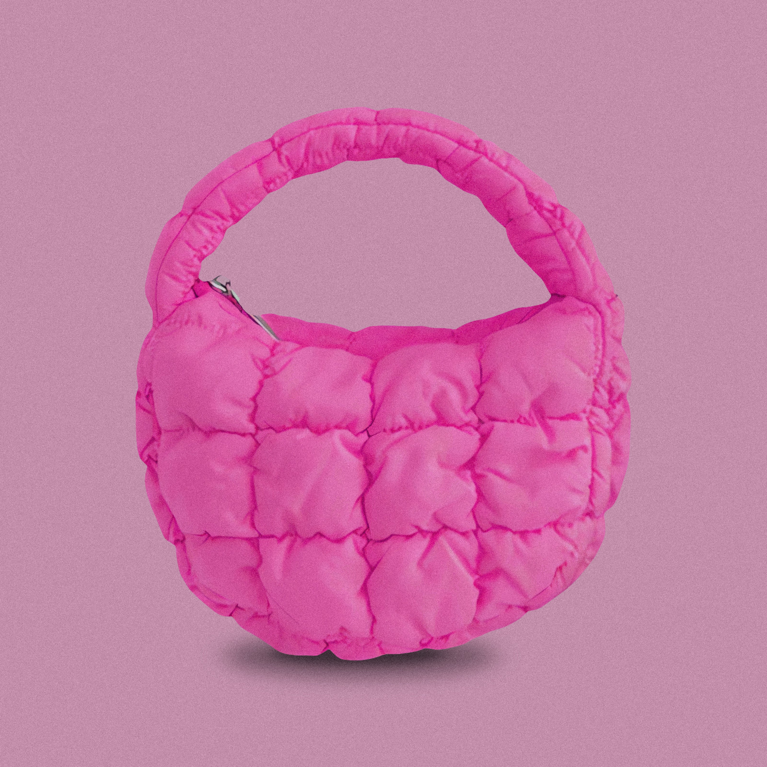 PLSH hot pink women’s designer puffer handbag on a pink background