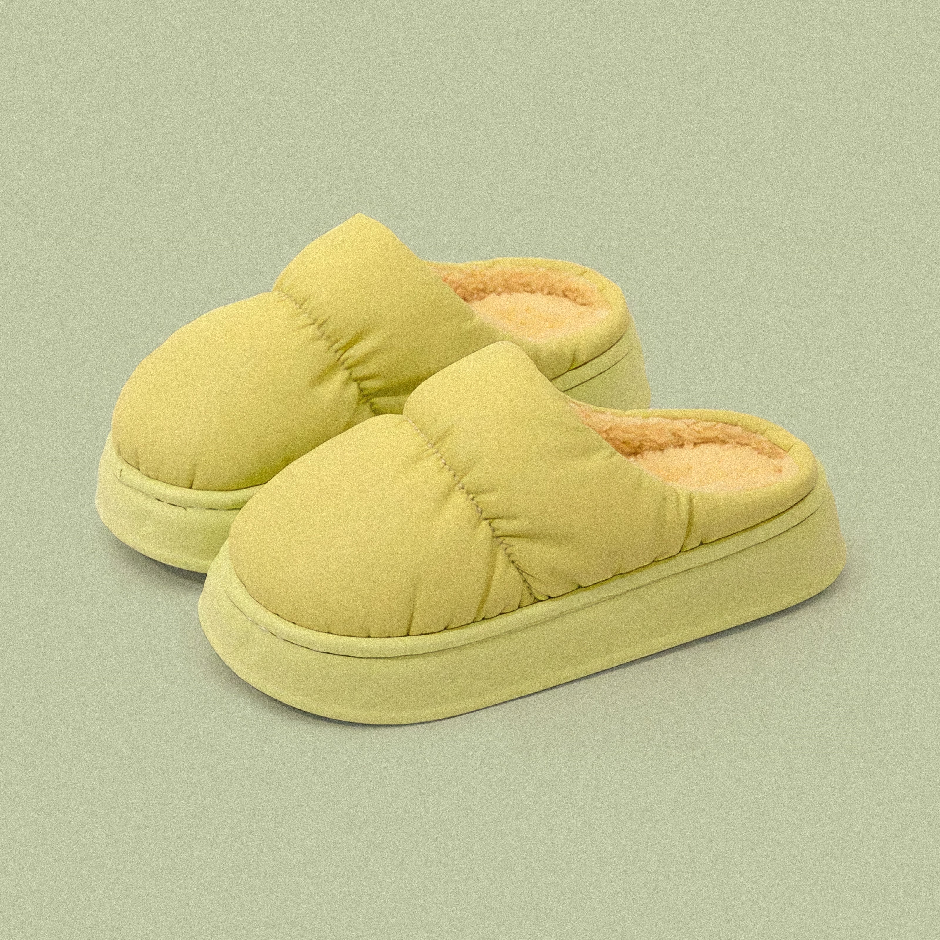 PLSH lime green women’s premium puffer slippers on a green background
